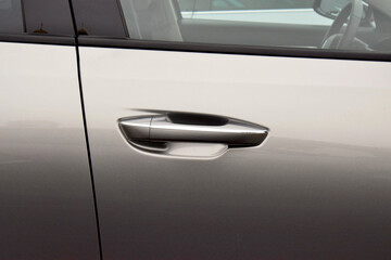 The inner door handle, the car interior detail