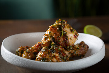 Chicken legs fried with garlic and parsley