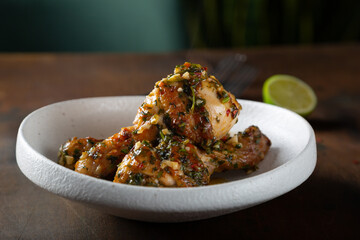 Chicken legs fried with garlic and parsley