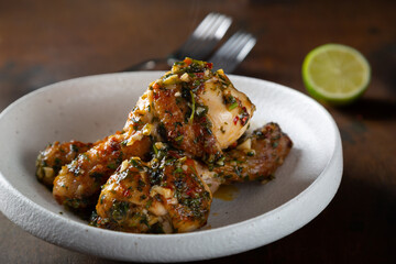 Chicken legs fried with garlic and parsley