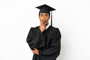 African American university graduate man over isolated white background surprised and shocked while looking right