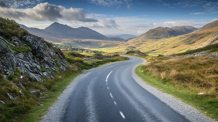 Scenic mountain road winding through lush green valley under vibrant blue sky with clouds : Generative AI