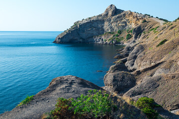 Picturesque seascape with beautiful view of Cape Kapchik and the Black Sea. Crimean Peninsula. Russia