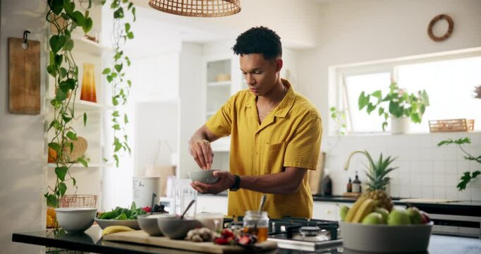 Man, fruit and smoothie with ingredients in kitchen for healthy diet, meal prep or nutrition at home. Male person, nutritionist or preparation with bowl for drink, breakfast beverage or detox snack