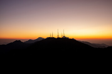 Mountain view in Rio de Janeiro with cell phone towers at sunset on the coast of Brazil