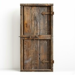 Rustic wooden door with metal hardware, standing against a white background, creating a contrast between old and new