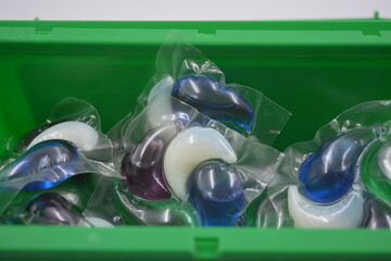 Things, objects for daily use, cleansing. Round polyethylene capsules filled with white, blue,...