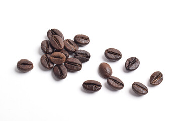 Many roasted coffee beans isolated on white background, top view