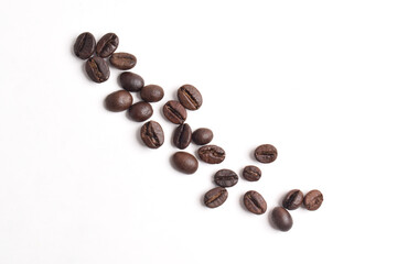 Many roasted coffee beans isolated on white background, top view