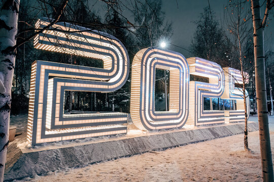 glowing light installation 2025. Festive glowing decorations for New Year on city street