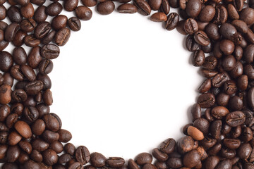 Roasted coffee beans with a circle Frame in the center on a white background. Top view with copy space for your text