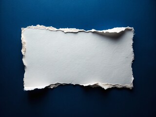 High-Resolution Drone Photography of a White Paper with Torn Edges Isolated on a Dark Blue Paper Background, Showcasing Detailed Texture and Contrast