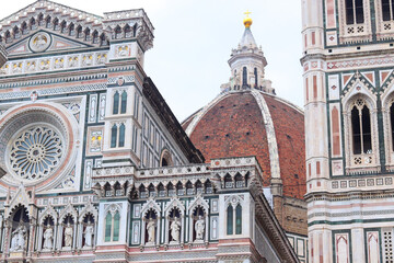 Florence, Italy - November 28, 2024: Close-up of architectural details on Florence Duomo (Cathedral of Santa Maria del Fiore), showcasing intricate Gothic design and Renaissance craftsmanship.