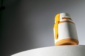 Abstract bottle with orange liquid