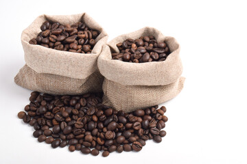 Roasted coffee bean in sack bag isolated on white background.