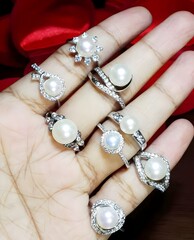 Elegant Pearl Ring Collection on a Hand