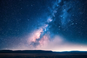 Fototapeta premium Celestial Majesty: The Milky Way in All Its Splendor Over a Peaceful Open Field, A Serene Nighttime Spectacle