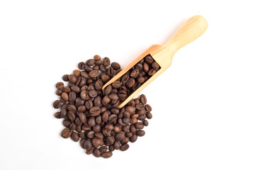 Roasted coffee beans in wooden spoon isolated on white background. Top view