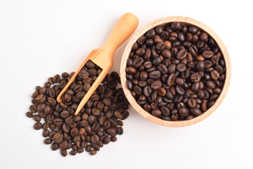 Coffee beans in wooden bowl isolated on white background
