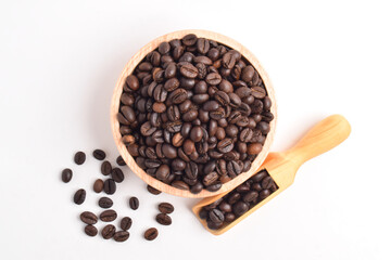 Coffee beans in wooden bowl isolated on white background