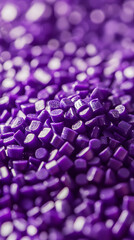 Purple plastic masterbatch granules, violet polymer granuels for injection molding, closeup of raw plastic granulat, background for chemistry and plastic companys