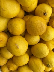 Close-up of lemon. Lemon wallpaper. Pile of lemon. lemon as the background.