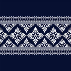 Elegant floral pattern on dark blue background, featuring intricate white designs. This decorative motif is perfect for textiles, wallpapers, and various crafts