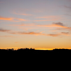 zen twilight sky glowing sunset silhouettes of distant tree lines