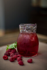 cold raspberry lemonade on the table in the summe