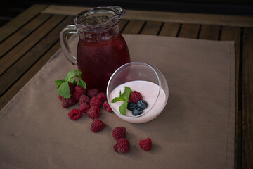 dessert against a carafe of lemonade on a summer table outside