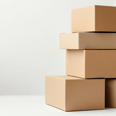 Fototapeta premium Stack of brown cardboard boxes arranged neatly on a white background.
