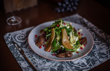pear and beef liver salad on the restaurant table