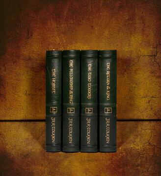 Hickory, North Carolina, USA-11 Dec 2024: Easton Press 4 volume set of Tolkien's 'The Hobbit' and 'Lord of the Rings' trilogy.  Leather bound on colorful background.