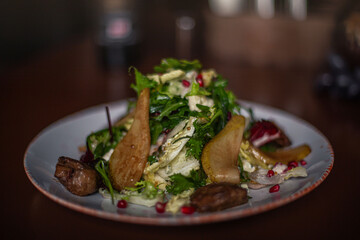 pear and beef liver salad on the restaurant table