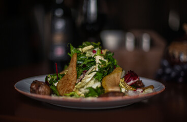 pear and beef liver salad on the restaurant table