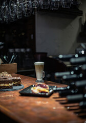 desserts on the restaurant table against the background of a coffee drink