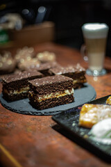 desserts on the restaurant table against the background of a coffee drink