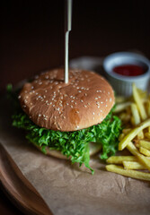 hamburger with fries and gravy on the restaurant table