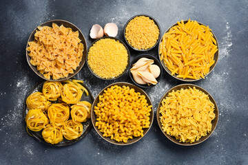 Various pasta in ceramic bowls. Cooking concept.