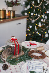 Christmas kitchen and table. Red, green and white decor christmas tree background. New Year celebration. Merry Christmas and Happy New Year.