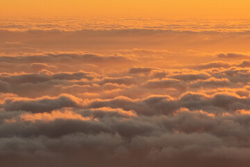 Ethereal sunrise with golden clouds