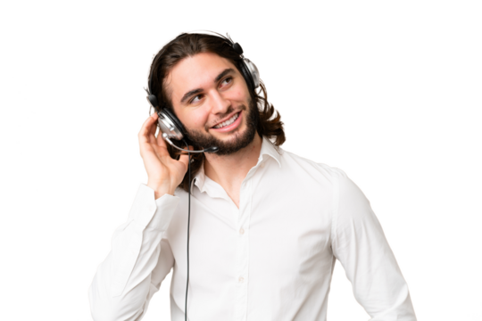 Telemarketer man working with a headset over isolated chroma key background thinking an idea