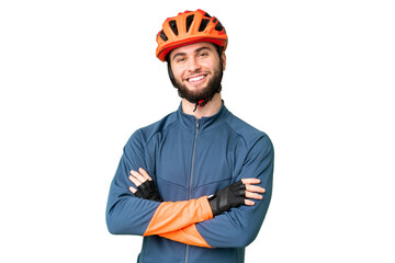 Young cyclist man over isolated chroma key background keeping the arms crossed in frontal position