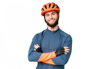 Young cyclist man over isolated chroma key background keeping the arms crossed in frontal position