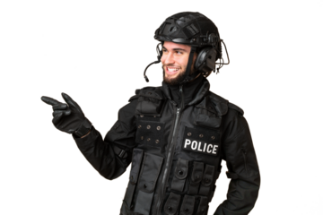 SWAT over isolated chroma key background pointing finger to the side and presenting a product