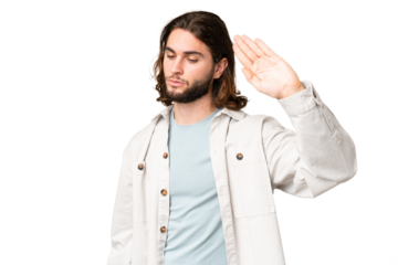 Young handsome man over isolated chroma key background making stop gesture and disappointed