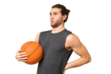 Obraz premium Young basketball player man over isolated background suffering from backache for having made an effort
