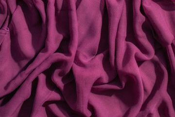 Soft purple fabric wavy crumpled background abstract.