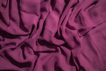 Soft purple fabric wavy crumpled background abstract.