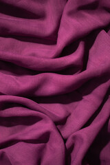 Soft purple fabric wavy crumpled background abstract.
